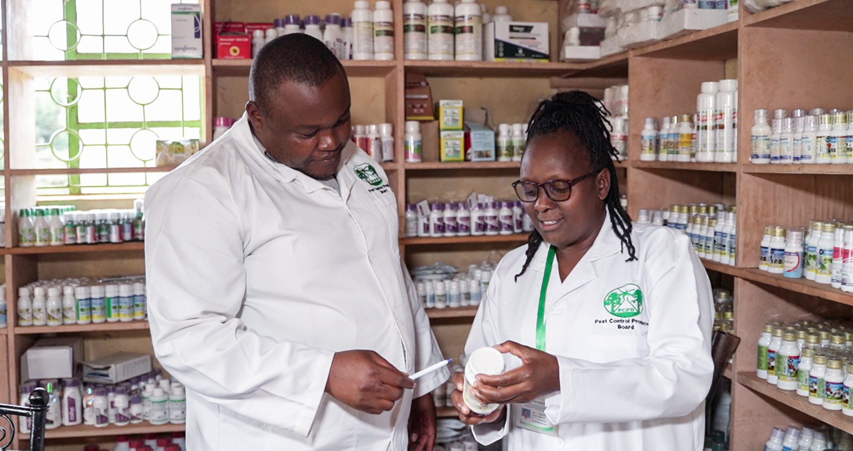 PCPB compliance & enforcement officers inspecting pest control products in an agrovet